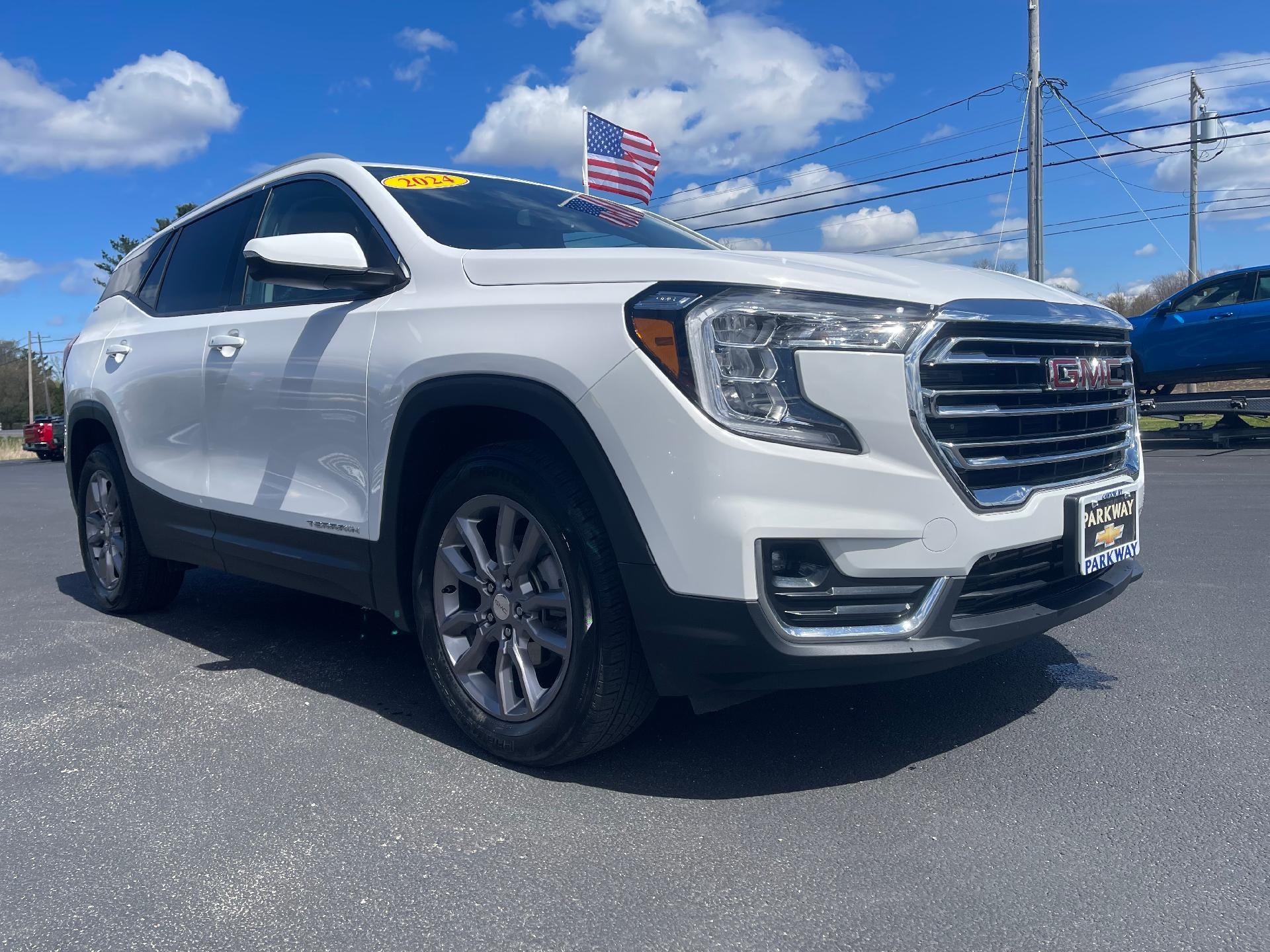 2024 GMC Terrain SLT in Summit White — front three-quarter view