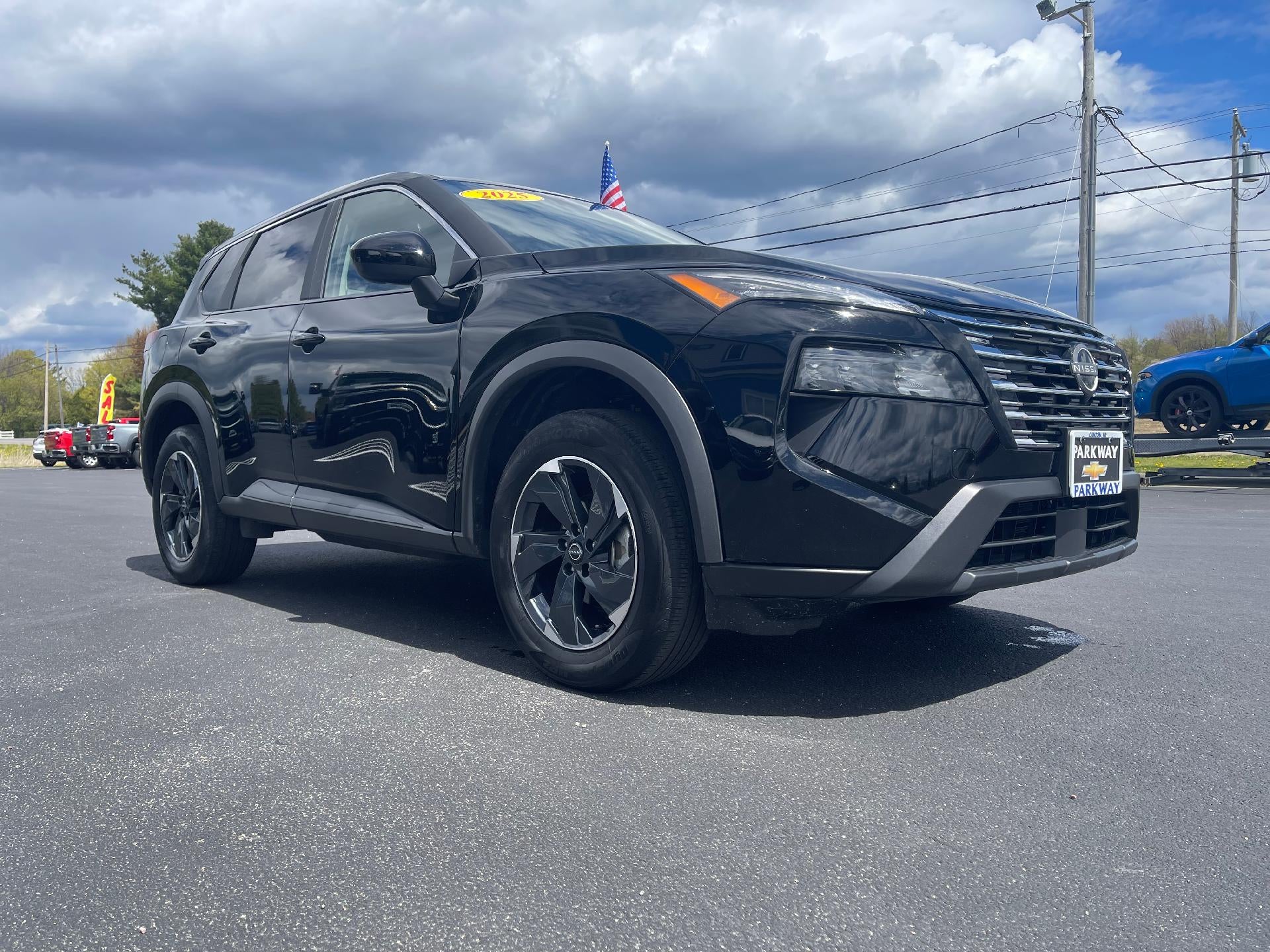 2025 Nissan Rogue SV in Black — front three-quarter view